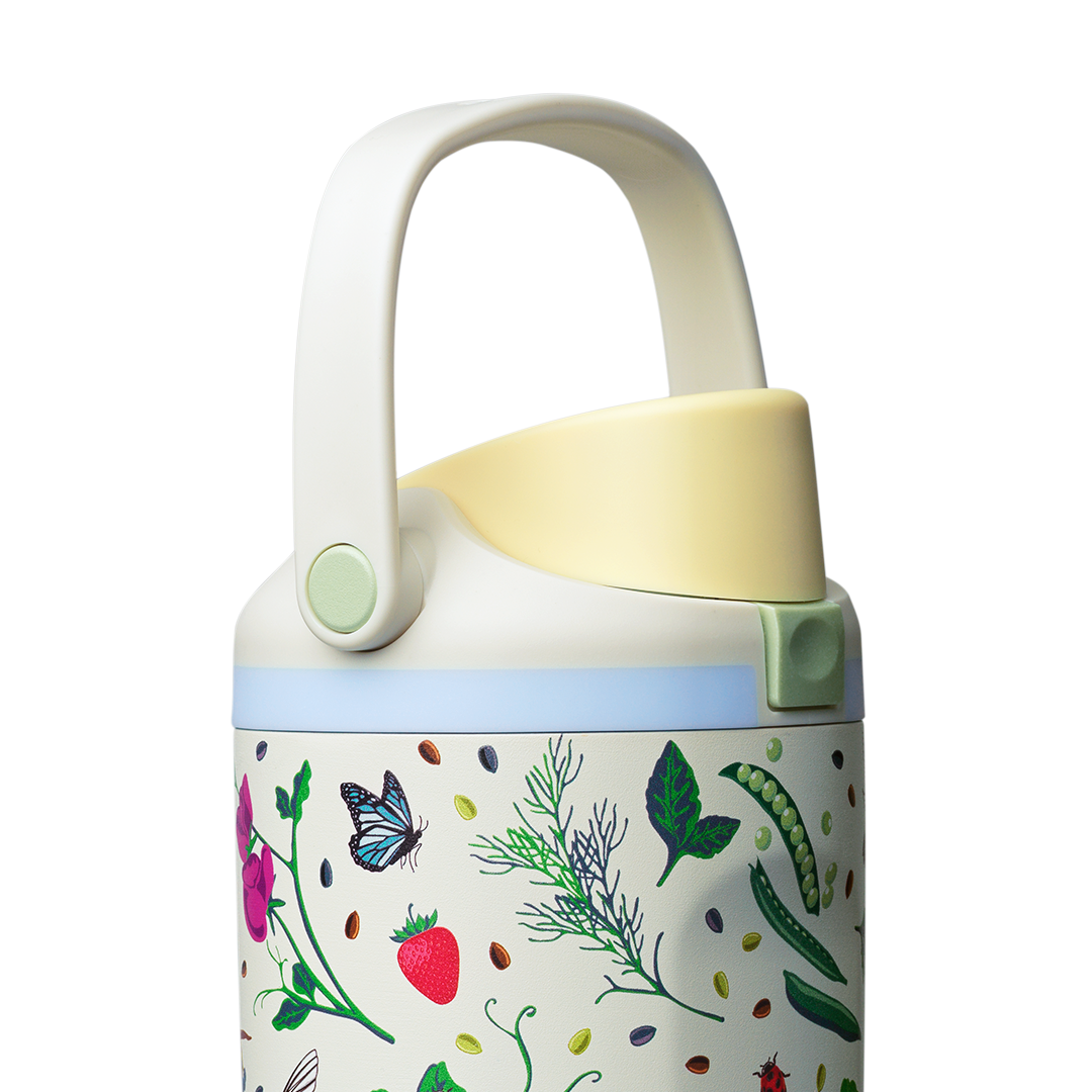 Owala FreeSip Sway 30oz, cream body with garden pattern, light blue lid with cream carry loop raised and yellow flip cap